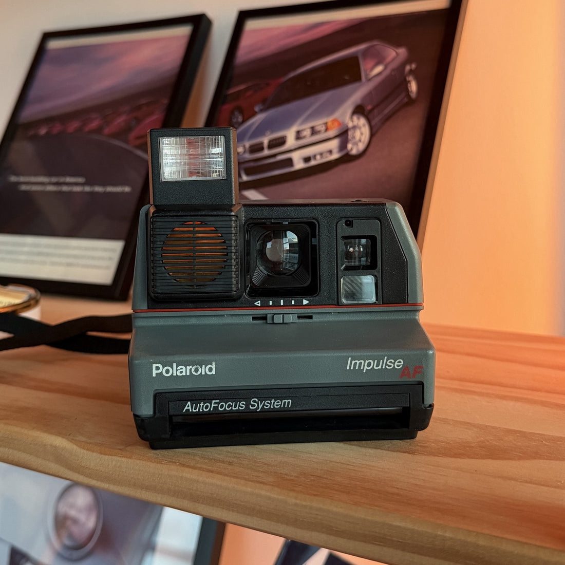 Polaroid Impulse AF instant camera with flash up, front